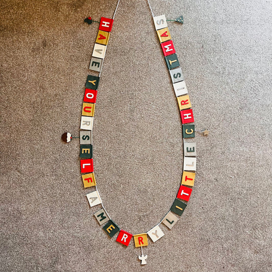 Have Yourself A Very Merry Christmas Bunting With Hanging Christmas Motifs.