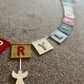 Have Yourself A Very Merry Christmas Bunting With Hanging Christmas Motifs.